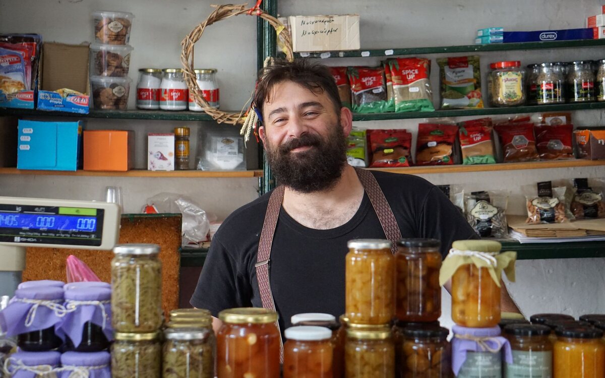 Small business owner smiling in their shop